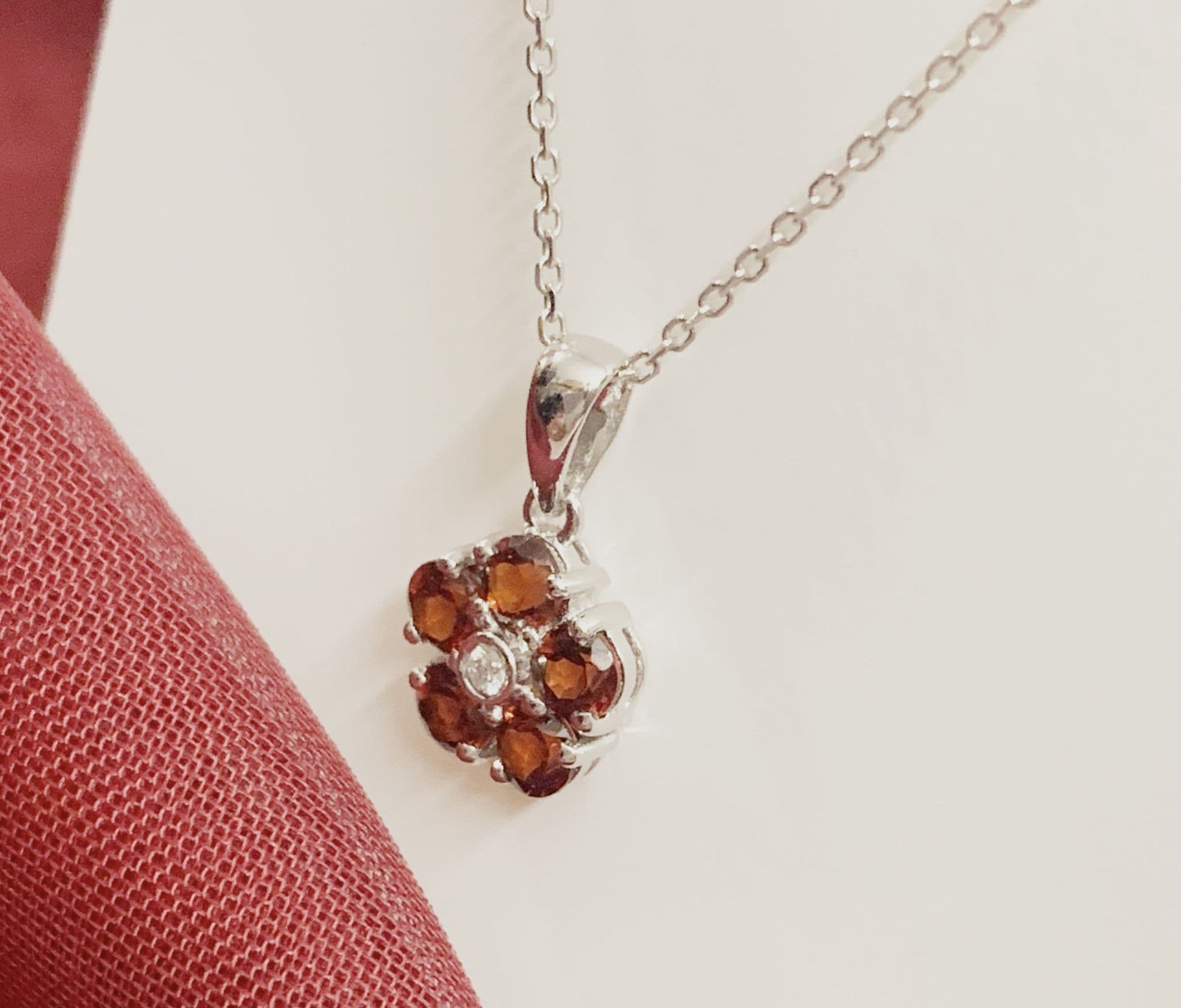 Red brown garnet and diamond white gold daisy cluster necklace pendant