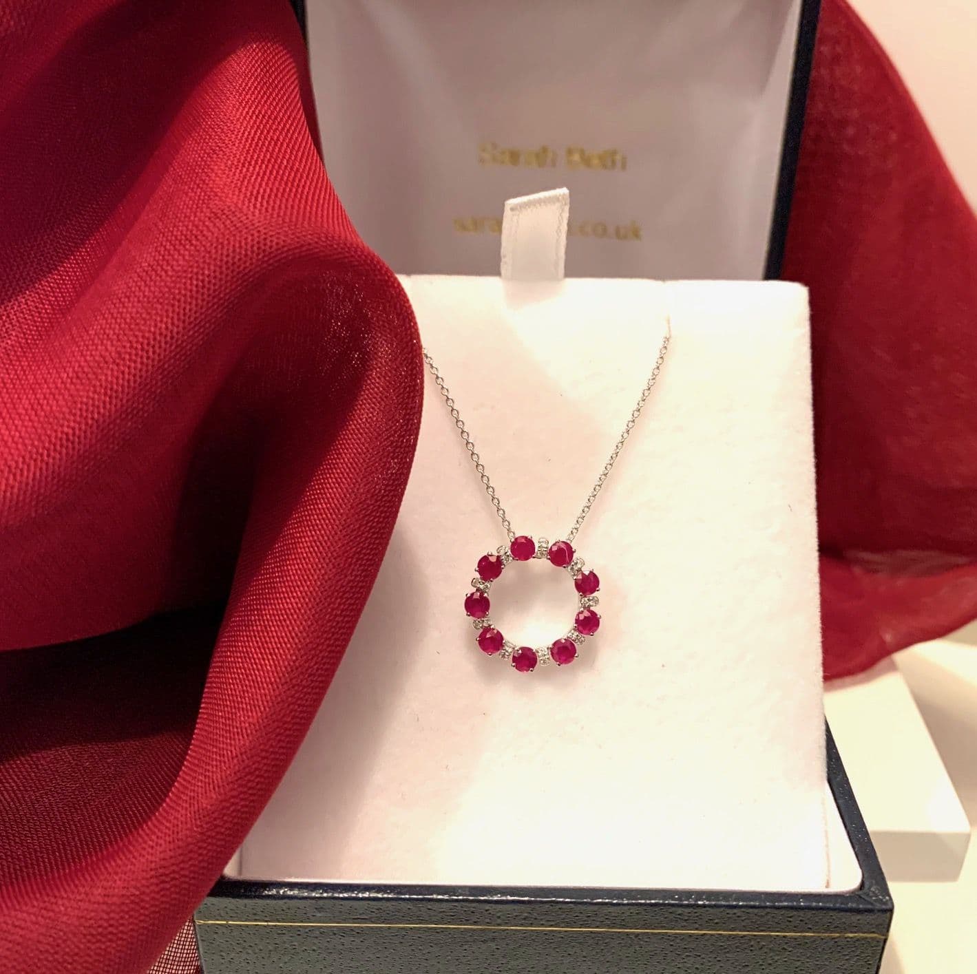 Real deep red round ruby and diamond white gold circle cluster necklace