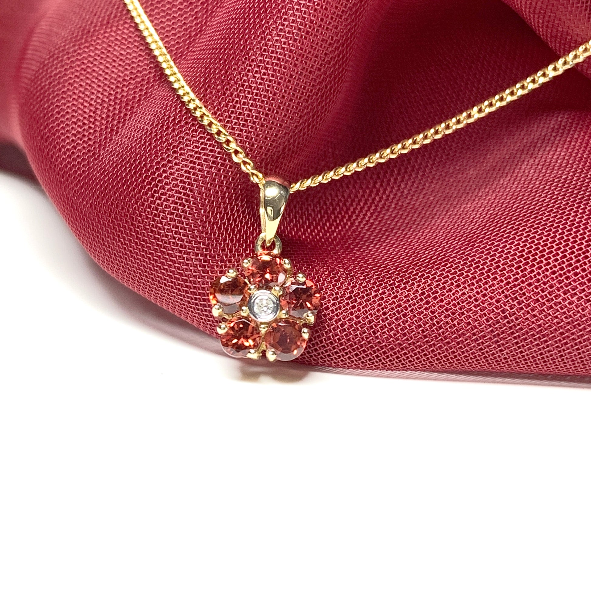 Red brown garnet and diamond yellow gold daisy cluster necklace pendant