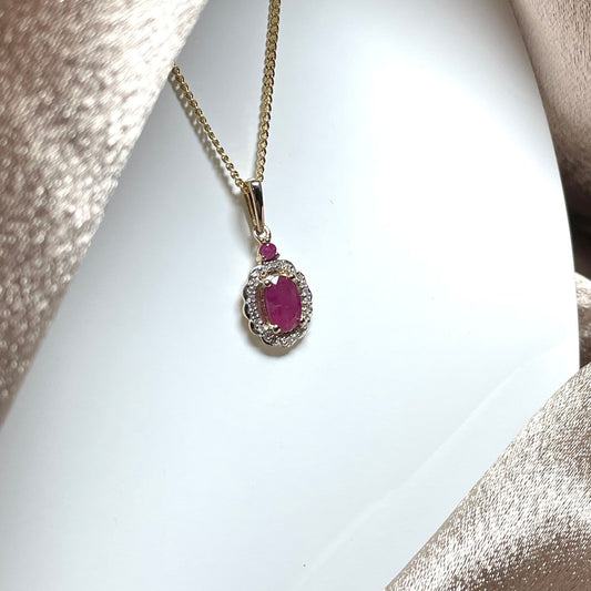 Oval red ruby and diamond necklace yellow gold