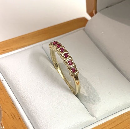 Red ruby eternity ring yellow gold