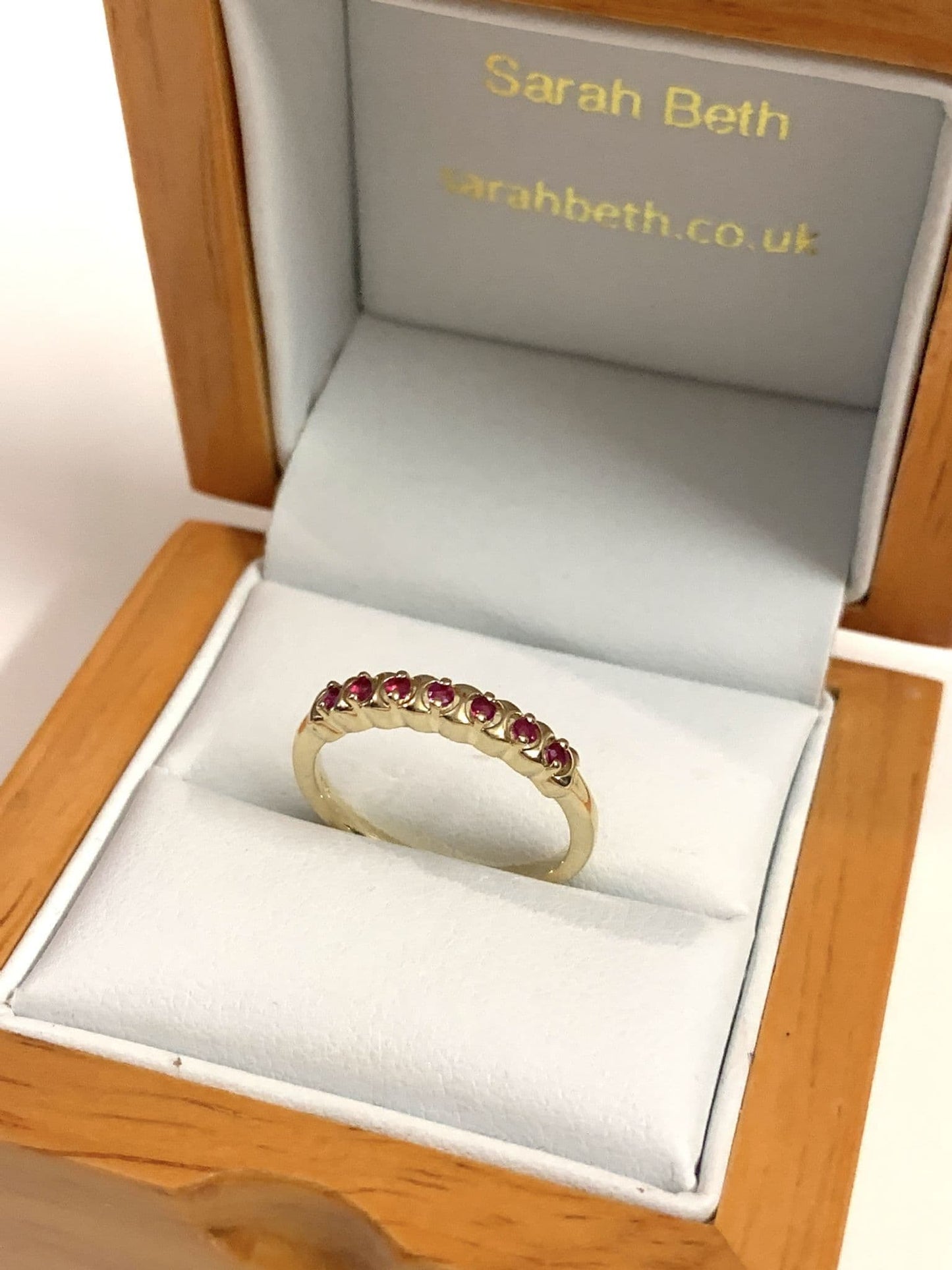 Red ruby eternity ring yellow gold