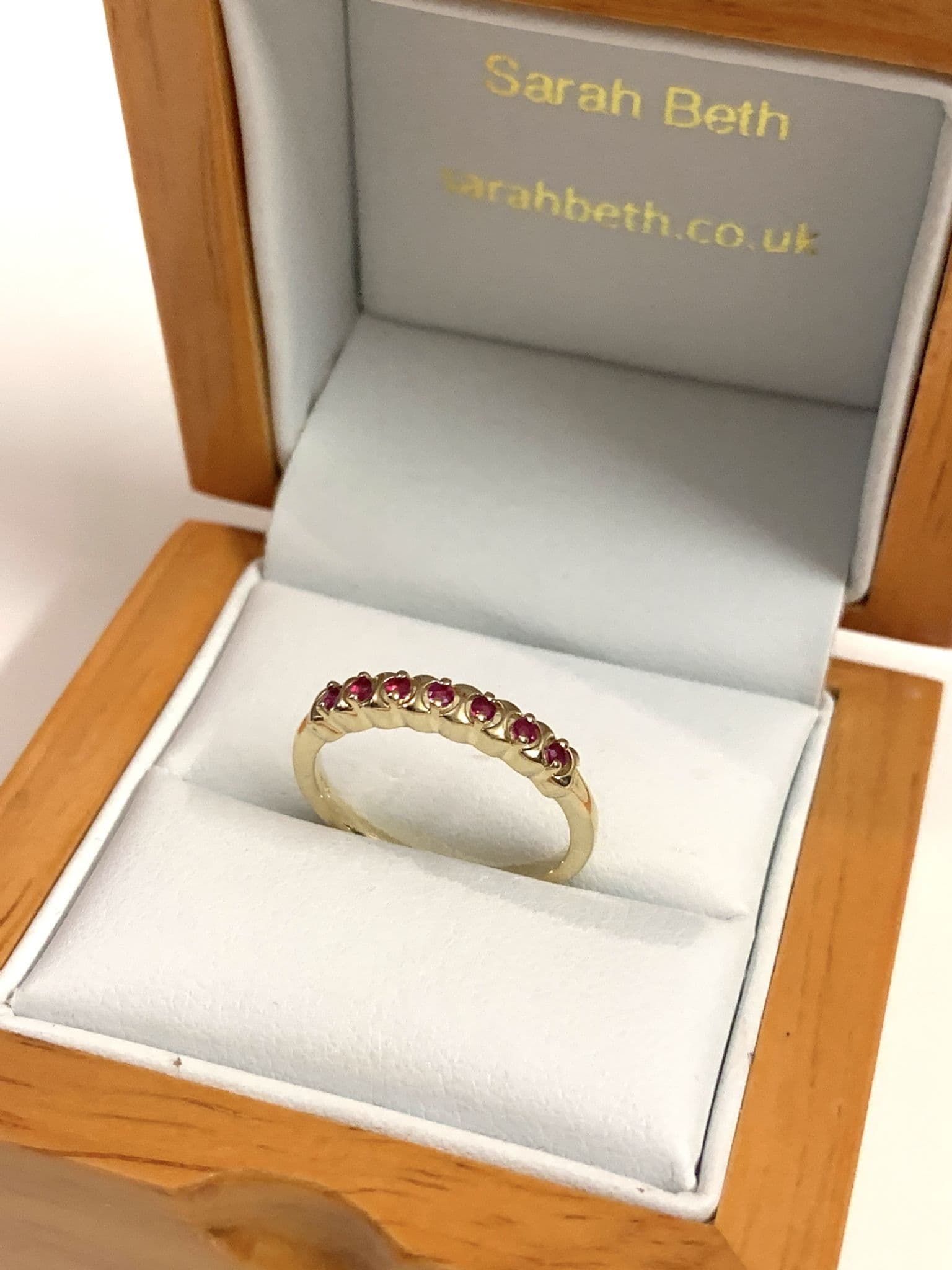 Red ruby eternity ring yellow gold