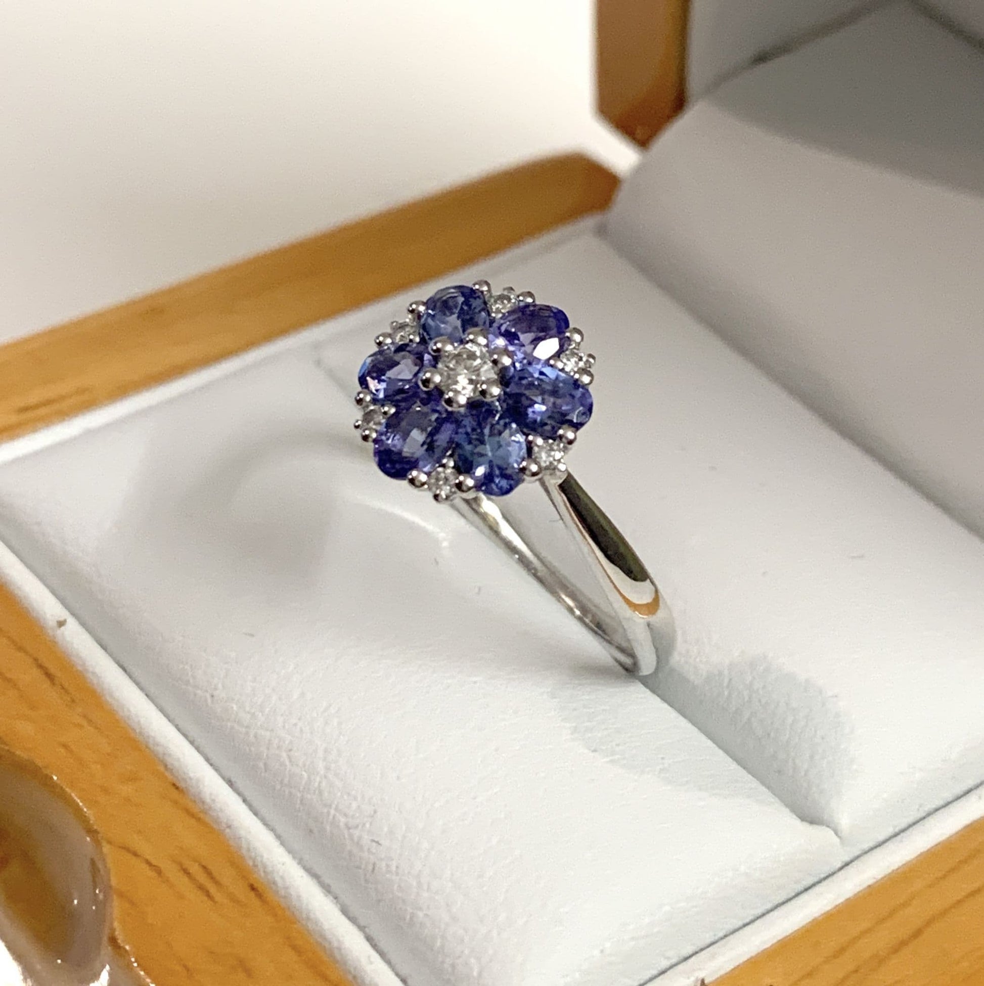 Round real tanzanite and diamond fancy white gold cluster ring