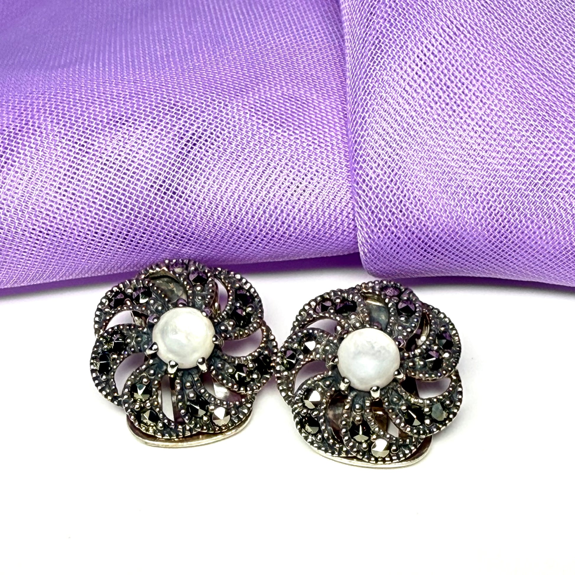 Round clip on earrings with marcasite and mother of pearl and  sterling silver