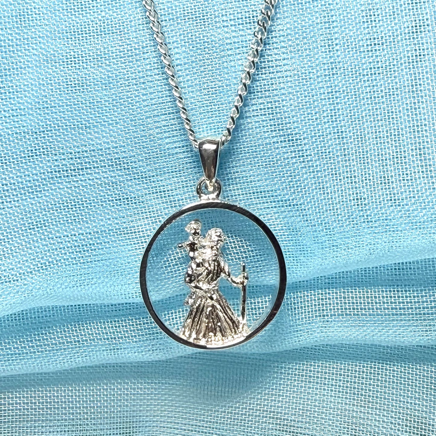 Round sterling silver St. Christopher including chain