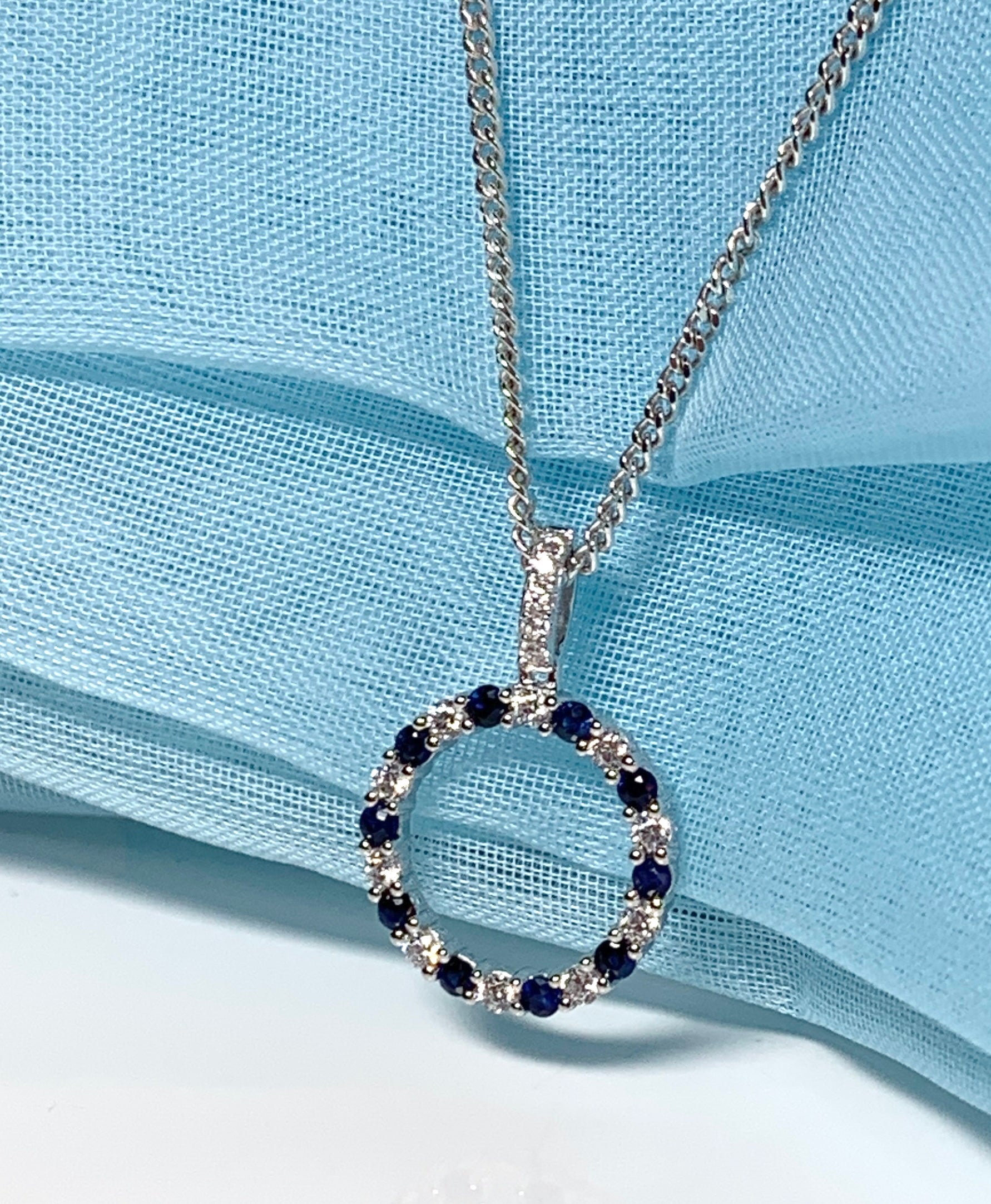 Round blue sapphire and cubic zirconia sterling silver necklace pendent