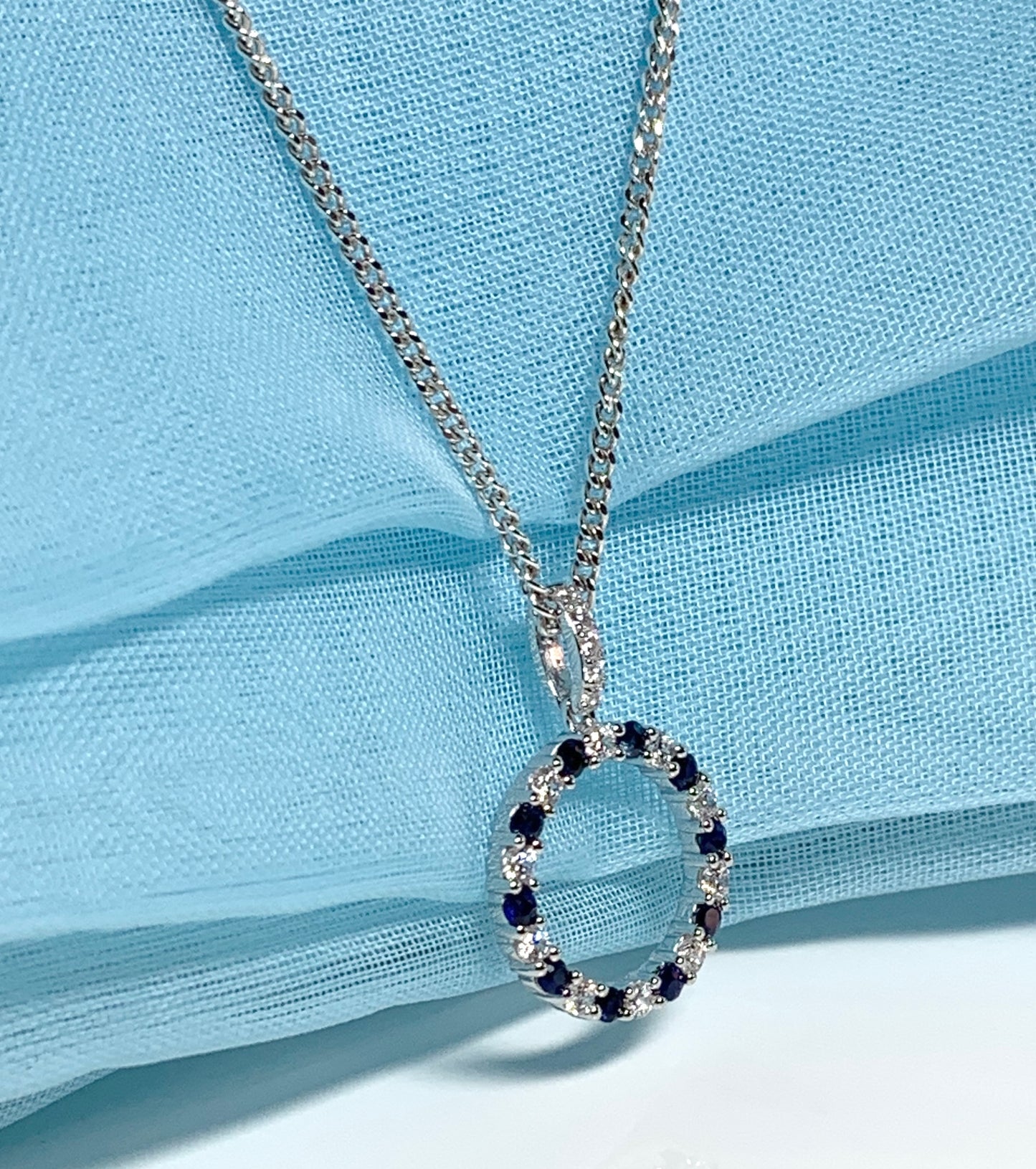 Round blue sapphire and cubic zirconia sterling silver necklace pendent