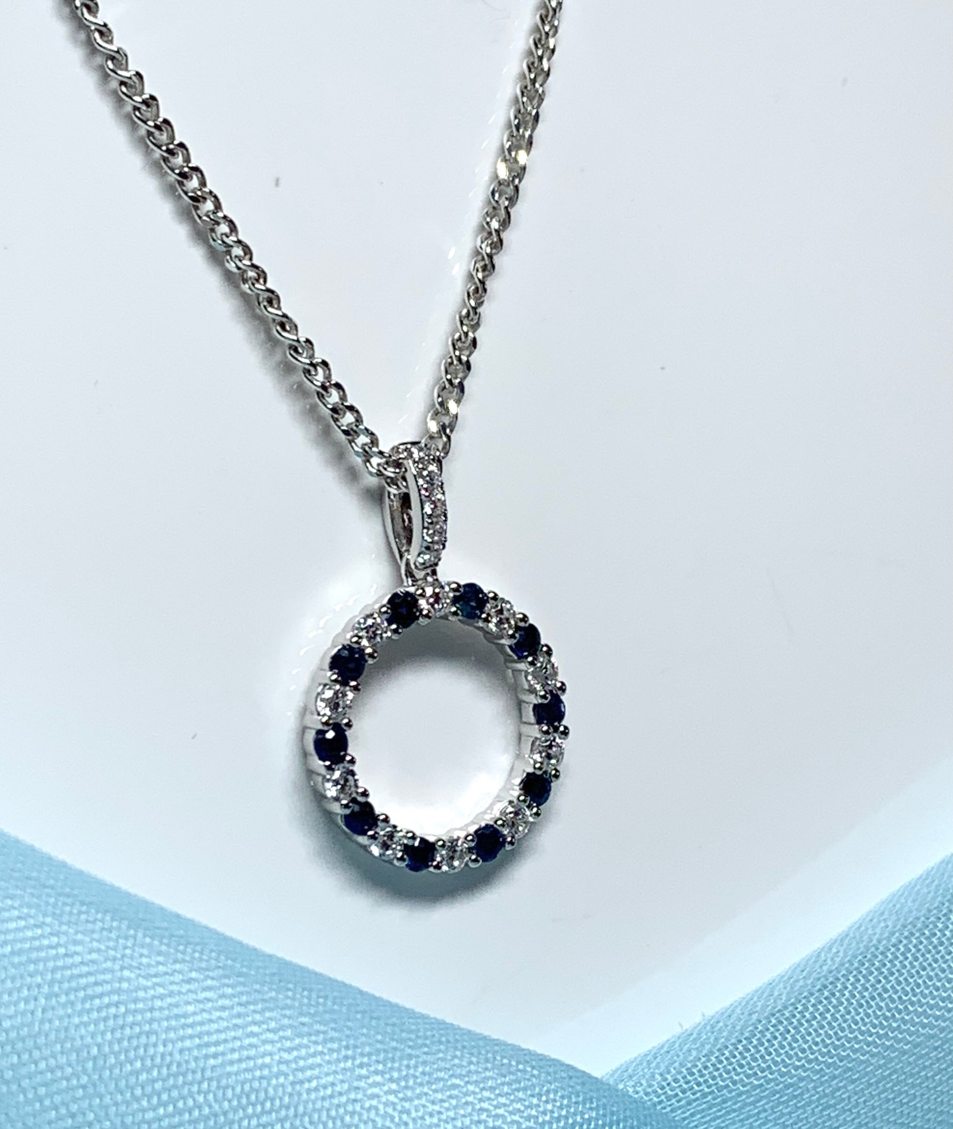 Round blue sapphire and cubic zirconia sterling silver necklace pendent