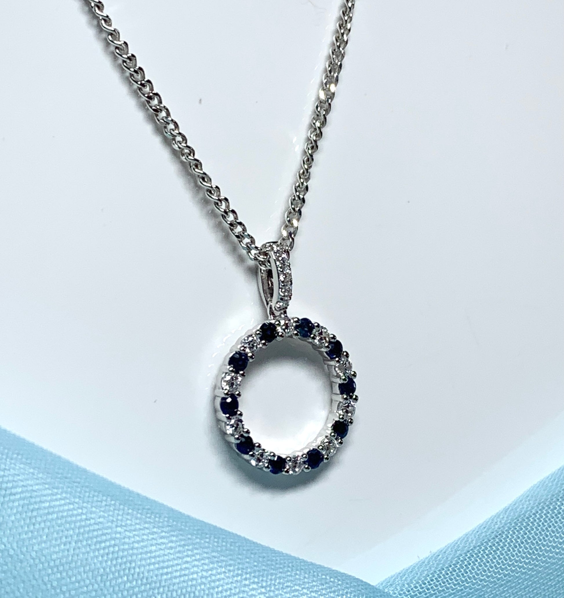 Round blue sapphire and cubic zirconia sterling silver necklace pendent