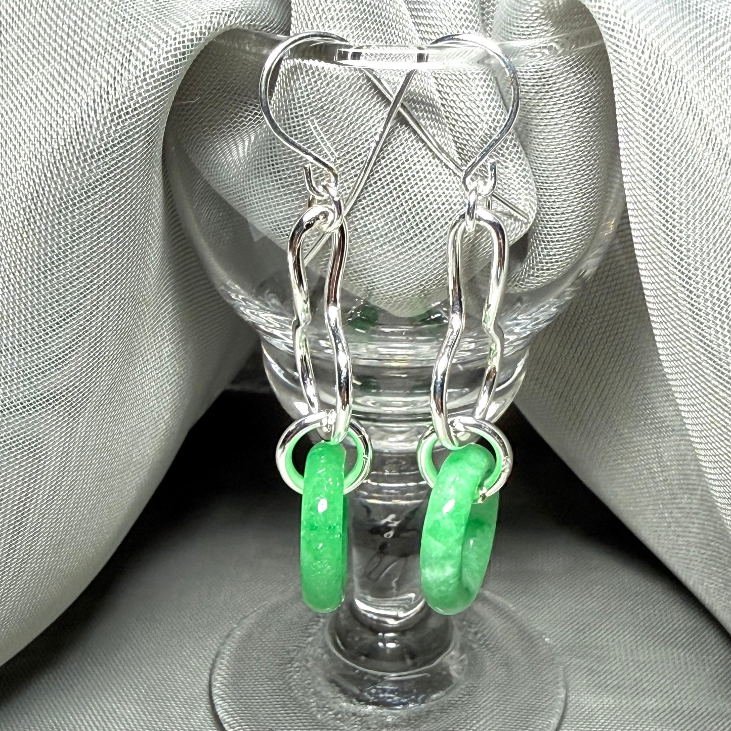 A rounded shaped real green jade sterling silver looped dangling dropped earrings