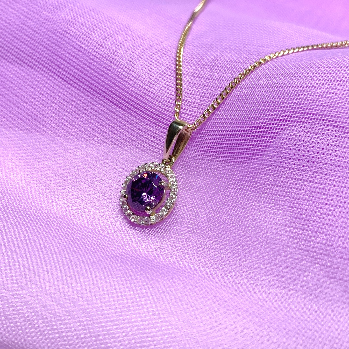 Round yellow gold and amethyst and cubic zirconia necklace pendent