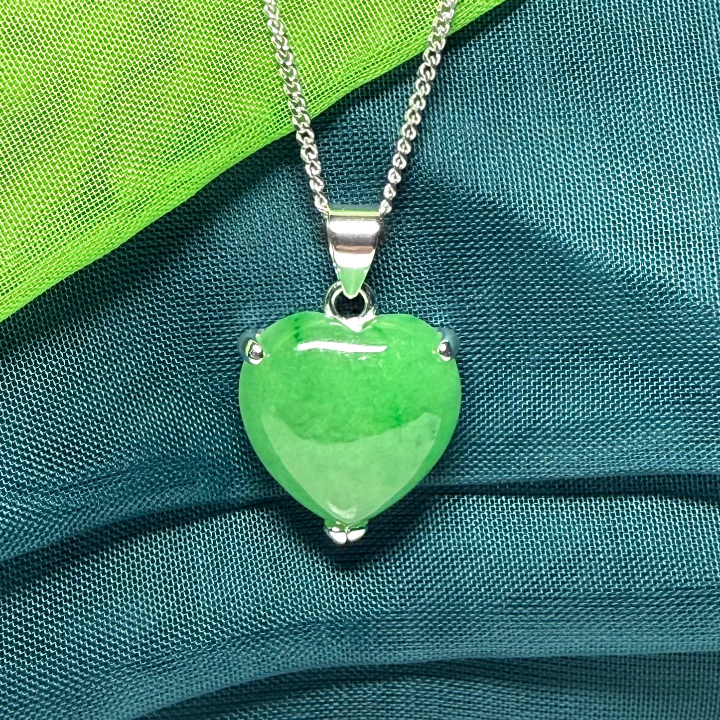 A real green jade necklace heart shape sterling silver, a timeless pendant and chain