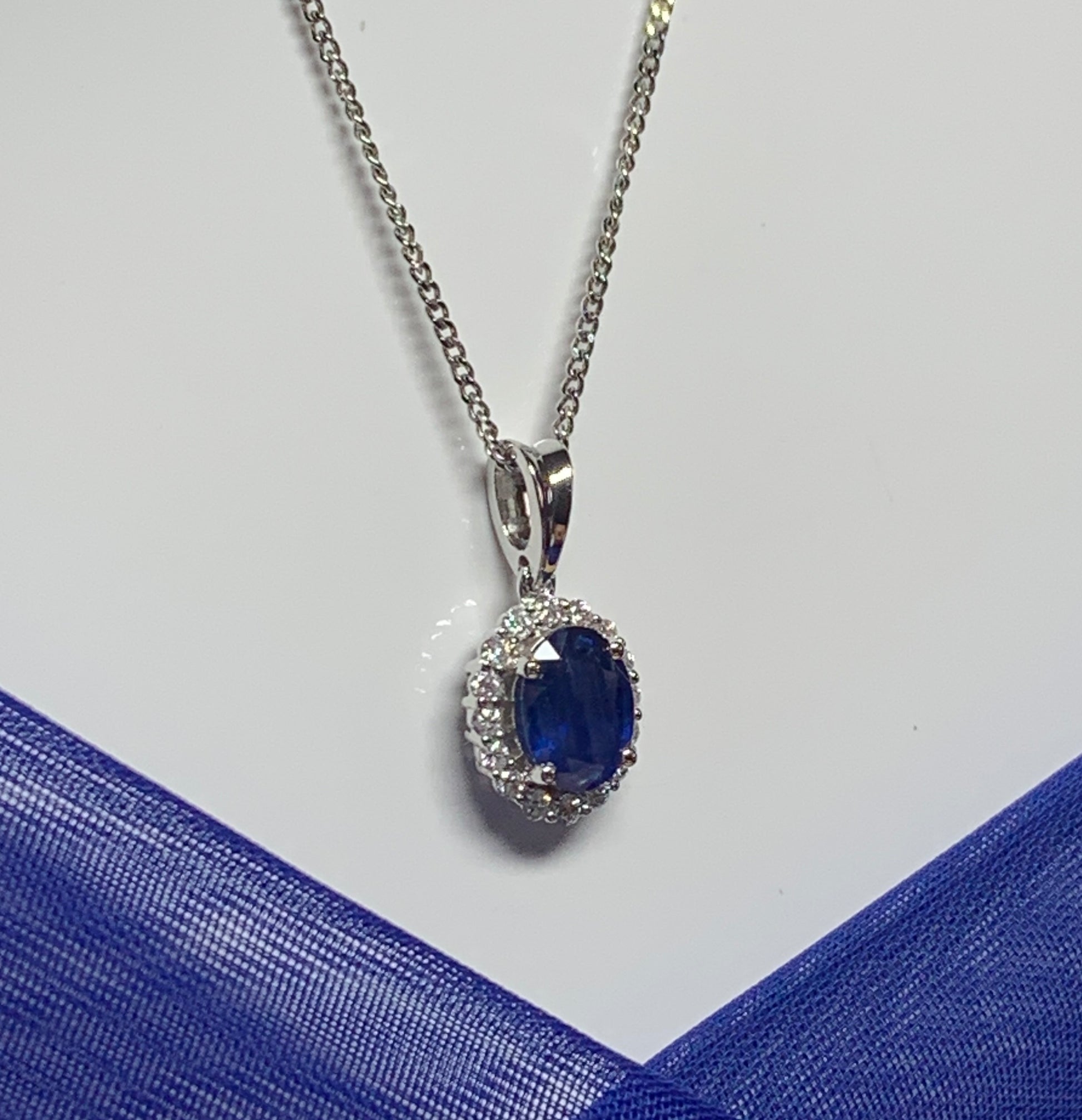 Real blue sapphire and diamond white gold cluster necklace oval pendant