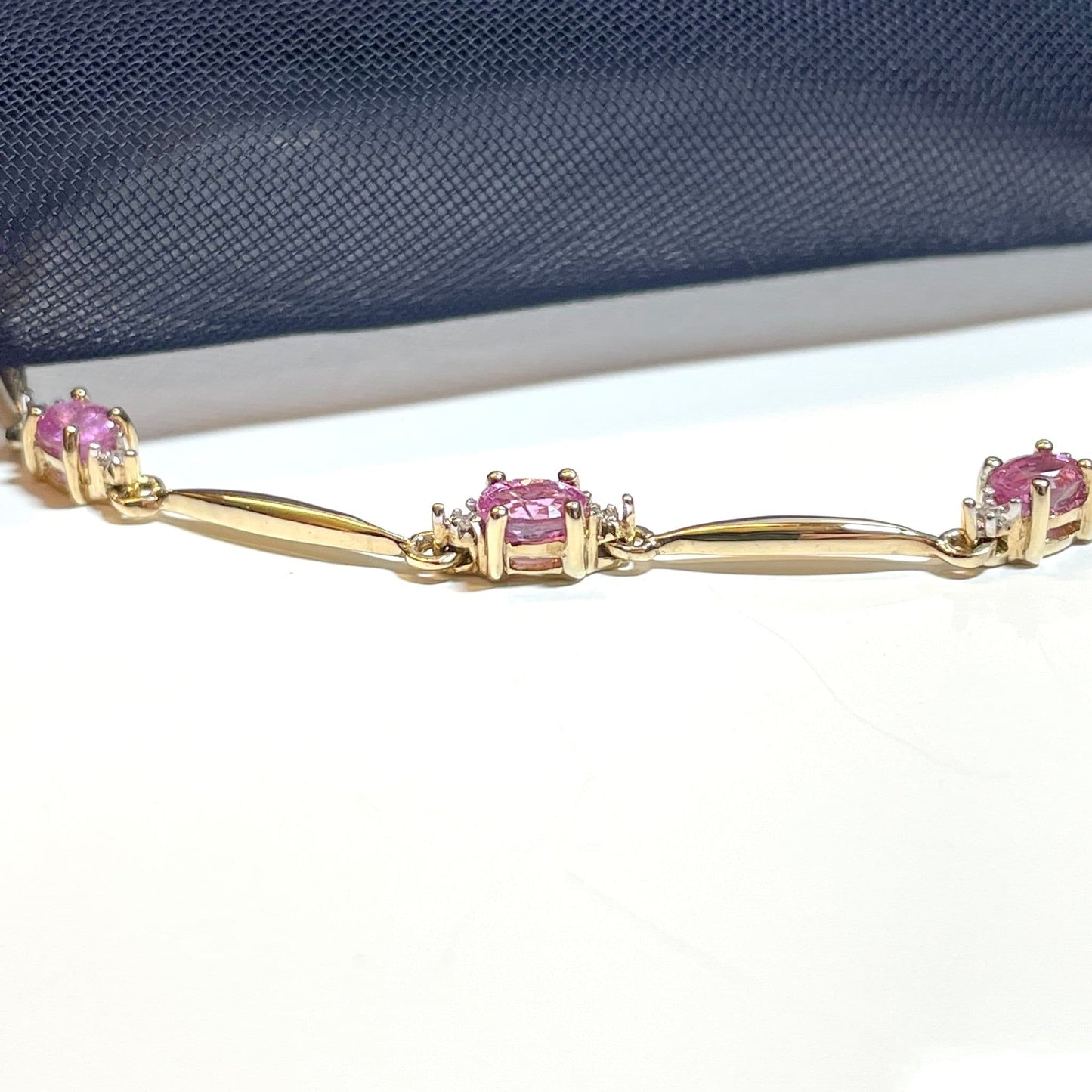 Pink sapphire and diamond yellow gold bracelet