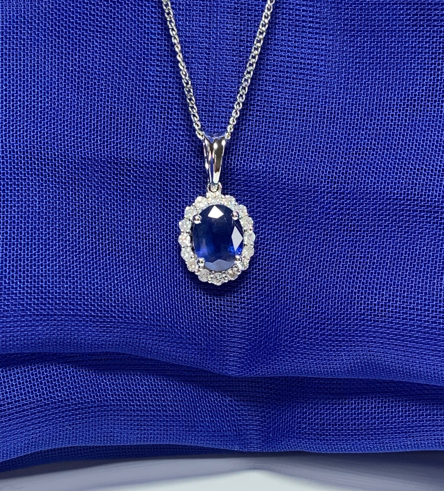 Real blue sapphire and diamond white gold cluster necklace oval pendant