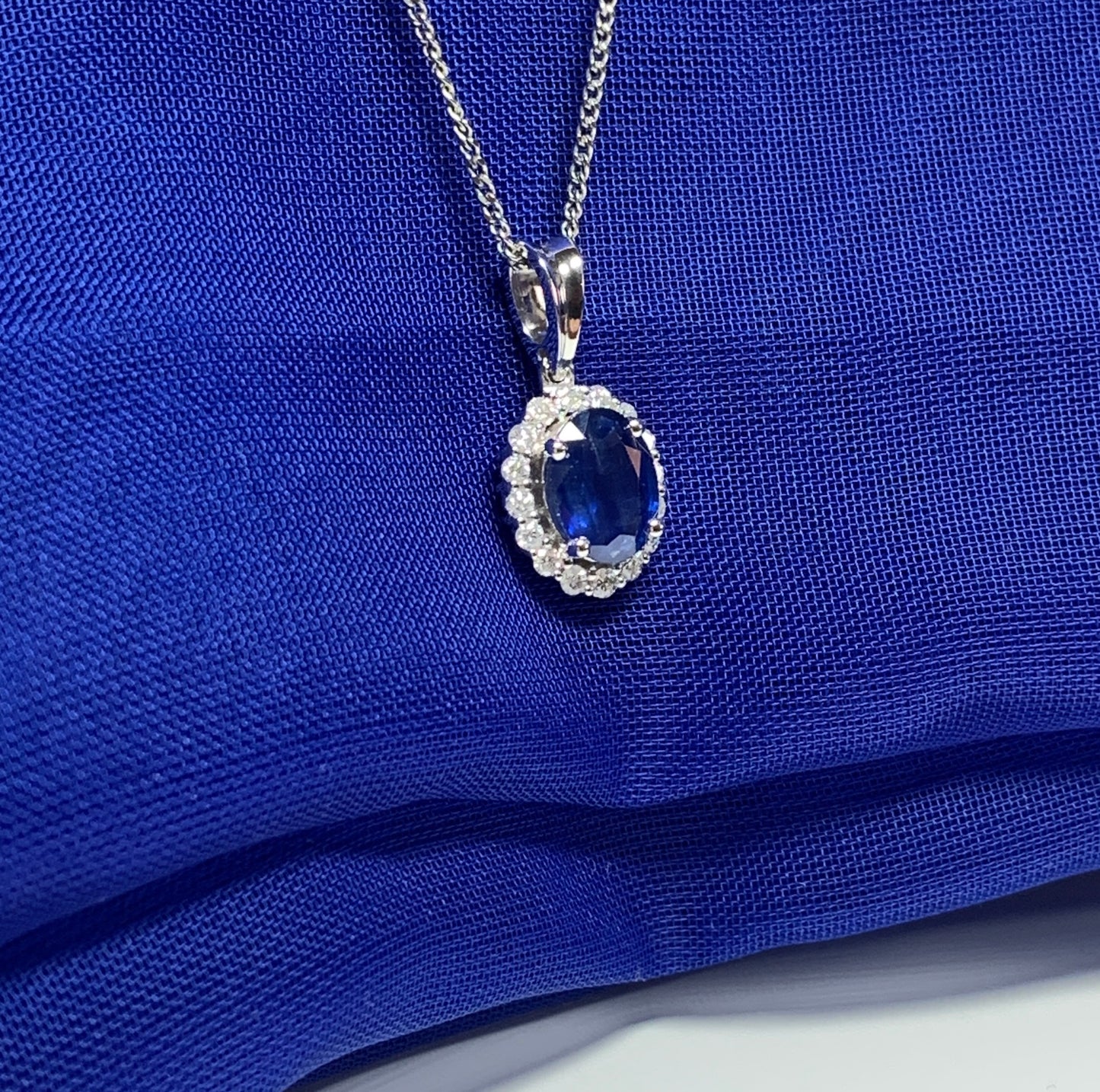 Real blue sapphire and diamond white gold cluster necklace oval pendant