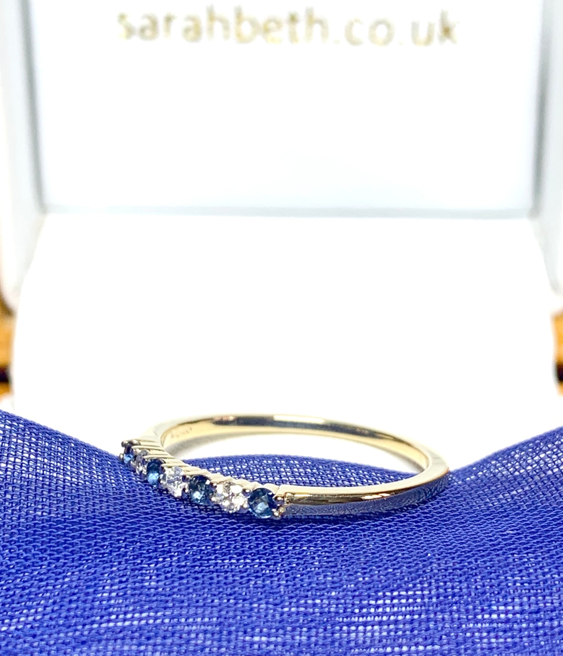 Blue Sapphire And Diamond Claw Set Eternity Ring