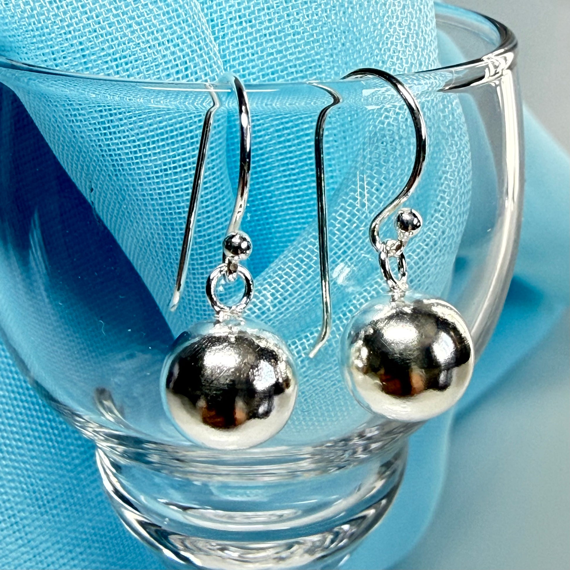 Sterling silver ball shaped drop earrings