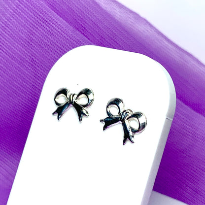 Sterling silver bow shaped stud earrings