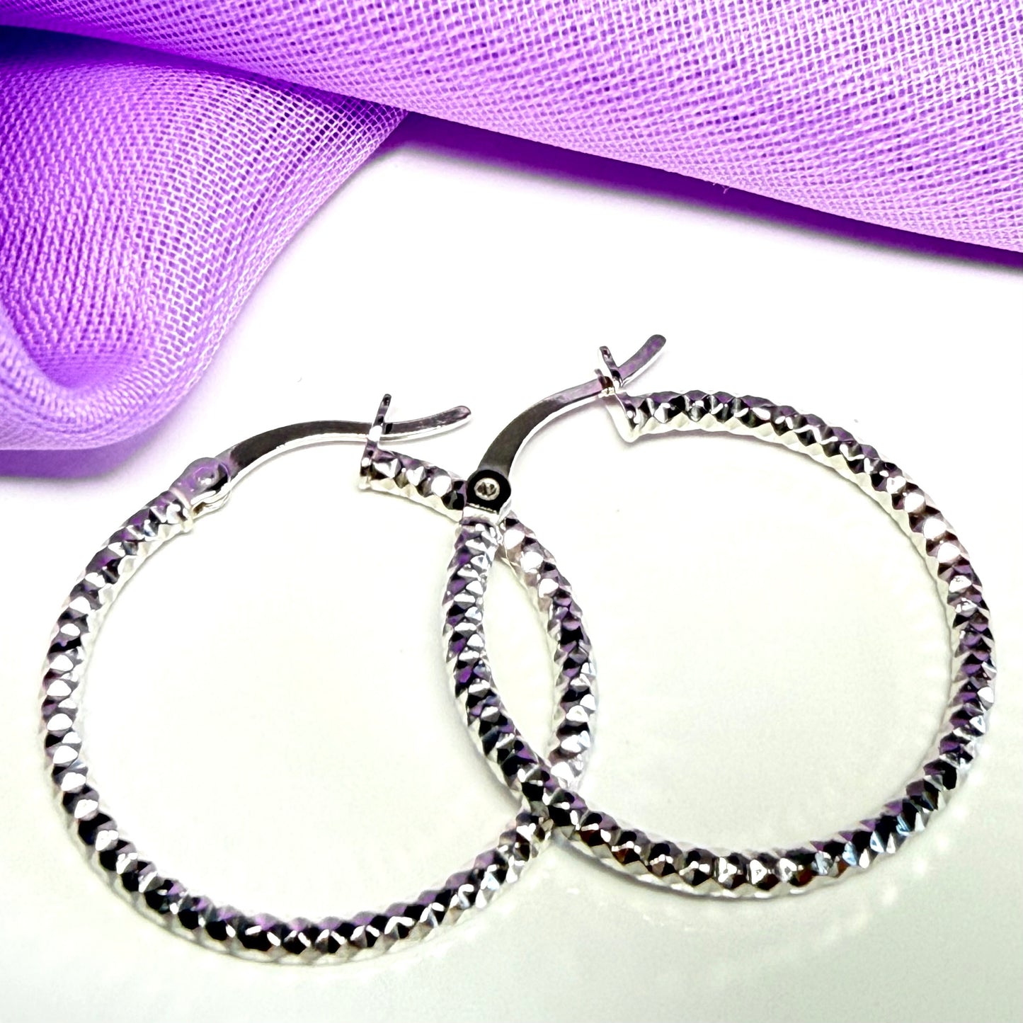 Silver hoop earrings diamond cut patterned