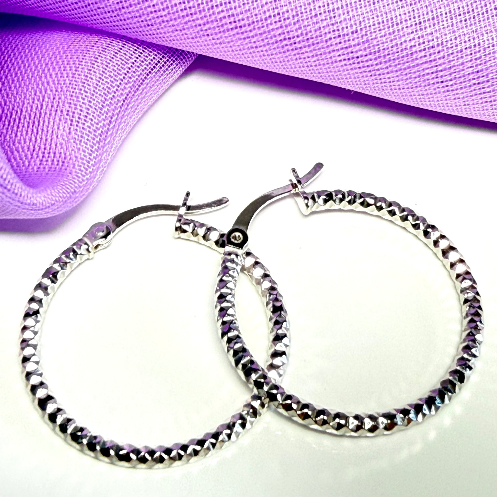 Silver hoop earrings diamond cut patterned