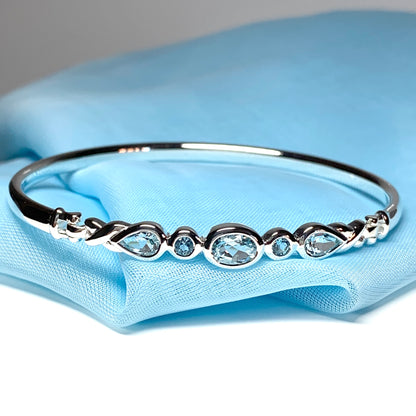 Sterling silver five stone blue topaz bangle