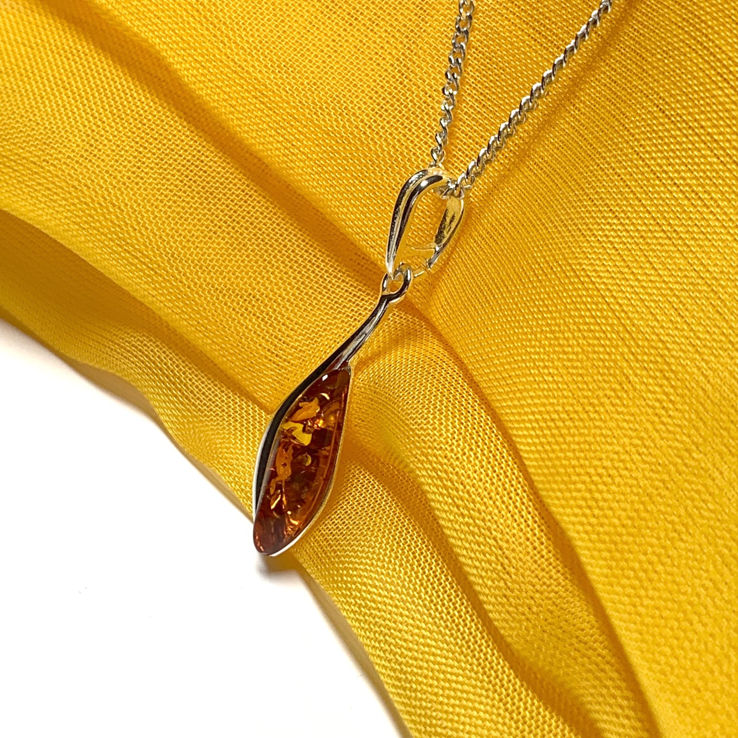 Sterling silver swirl real amber marquise shaped necklace