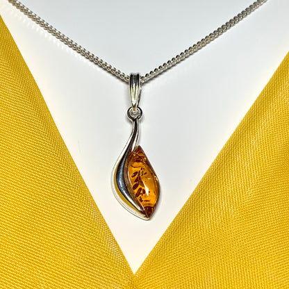 Sterling silver swirl real amber marquise shaped necklace