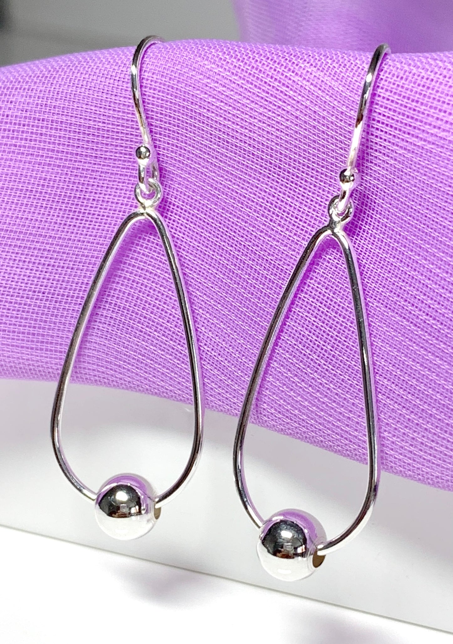 Sterling silver teardrop and ball shaped drop earrings