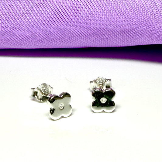 Small diamond set sterling silver daisy shaped stud earrings