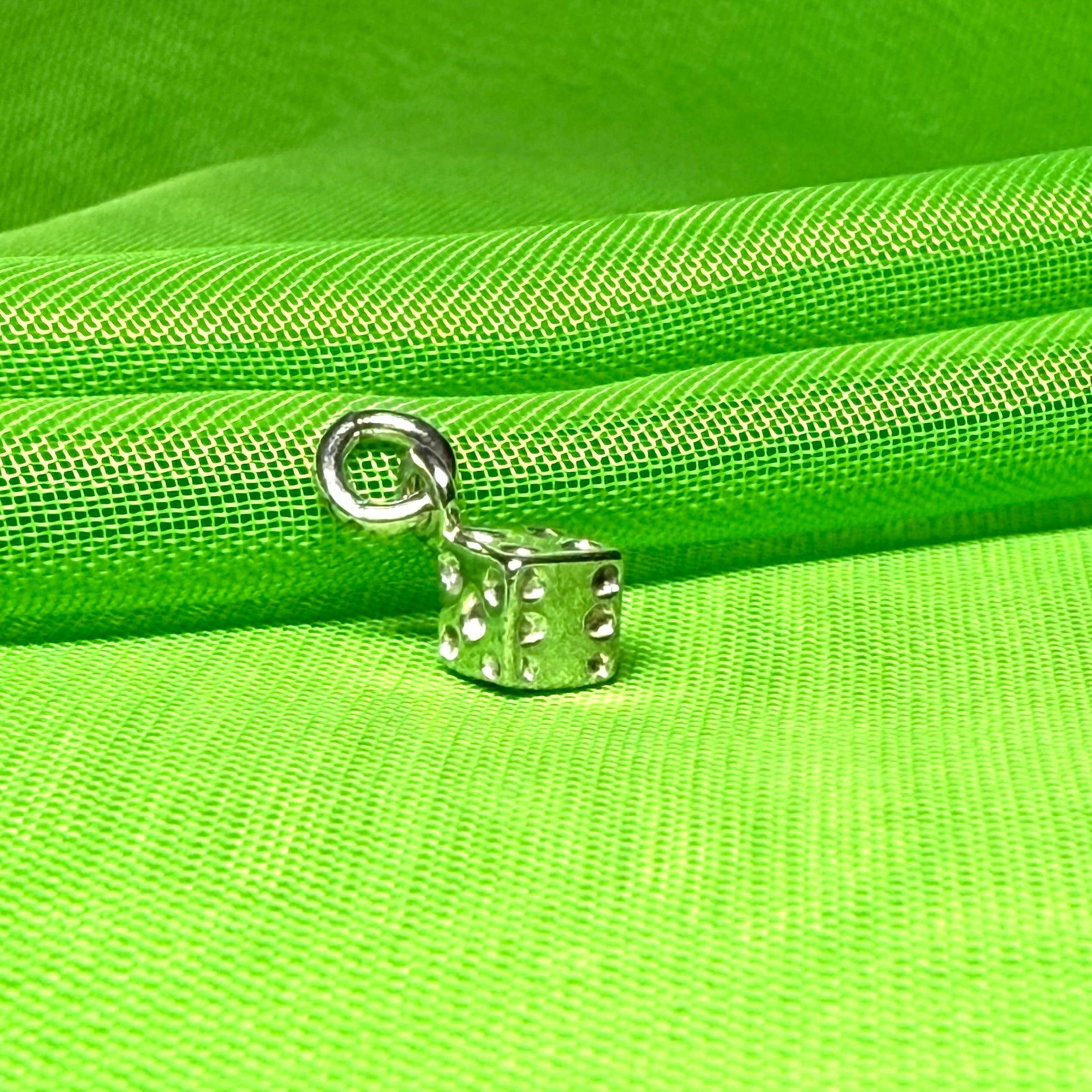 Small dice shaped sterling silver charm
