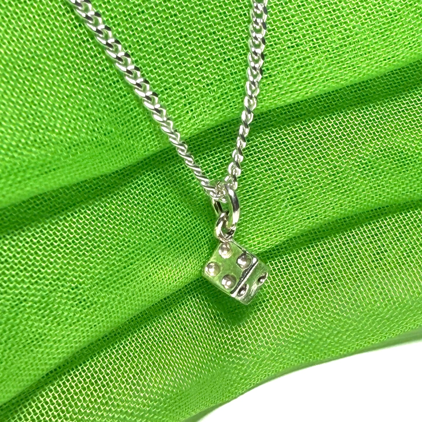 Small dice shaped sterling silver necklace