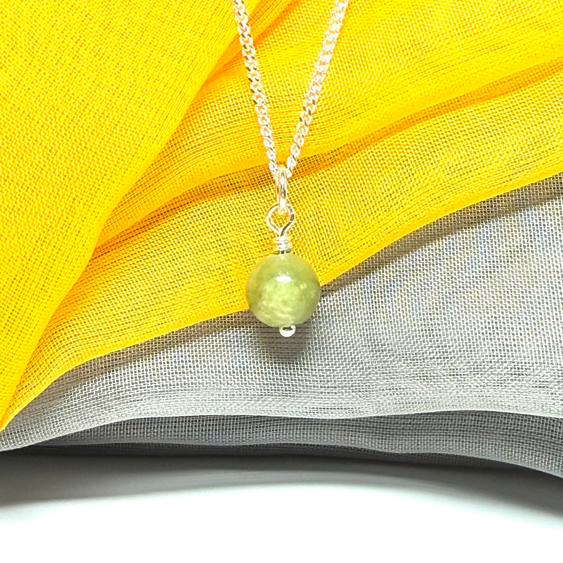 Small round 8.5 mm green real gypsum necklace ball shaped pendant with a chain