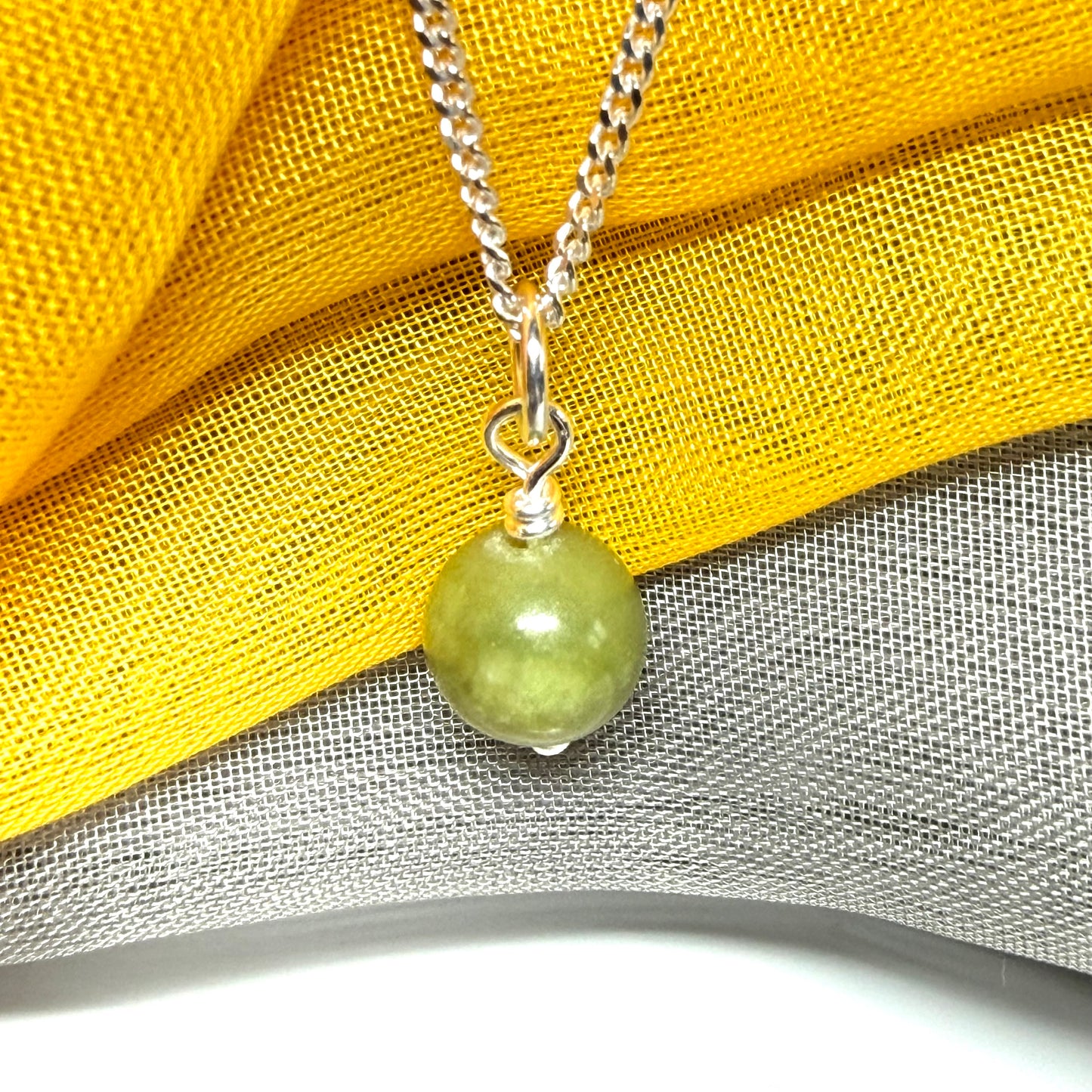Small round 8.5 mm green real gypsum necklace ball shaped pendant with a chain