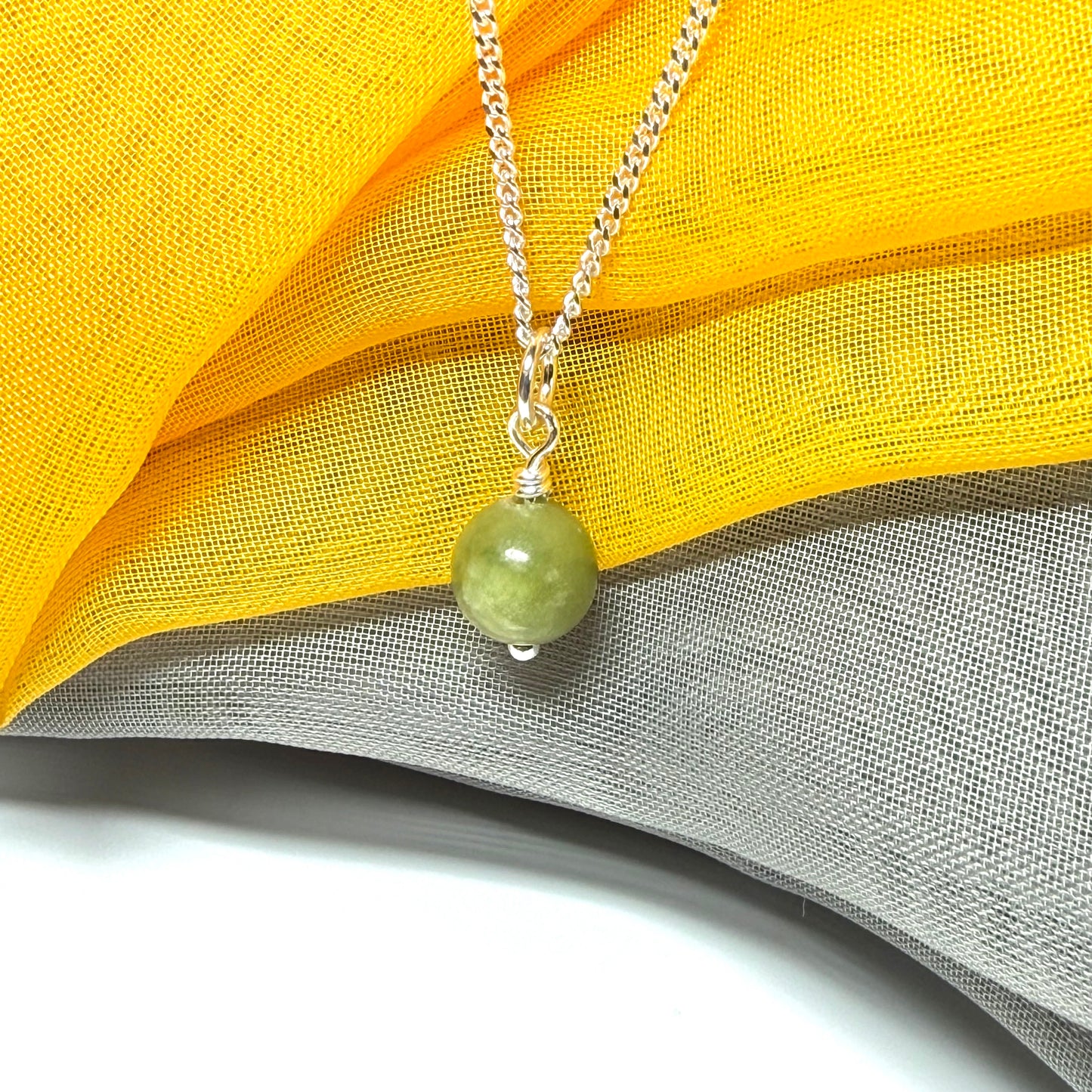 Small round 8.5 mm green real gypsum necklace ball shaped pendant with a chain