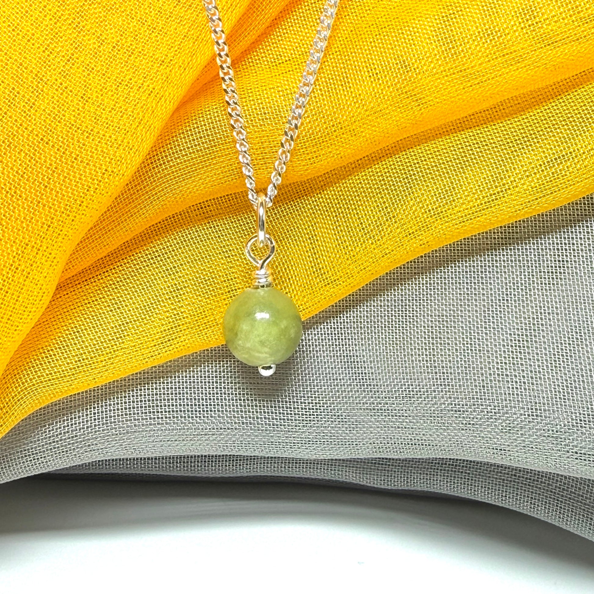Small round 8.5 mm green real gypsum necklace ball shaped pendant with a chain