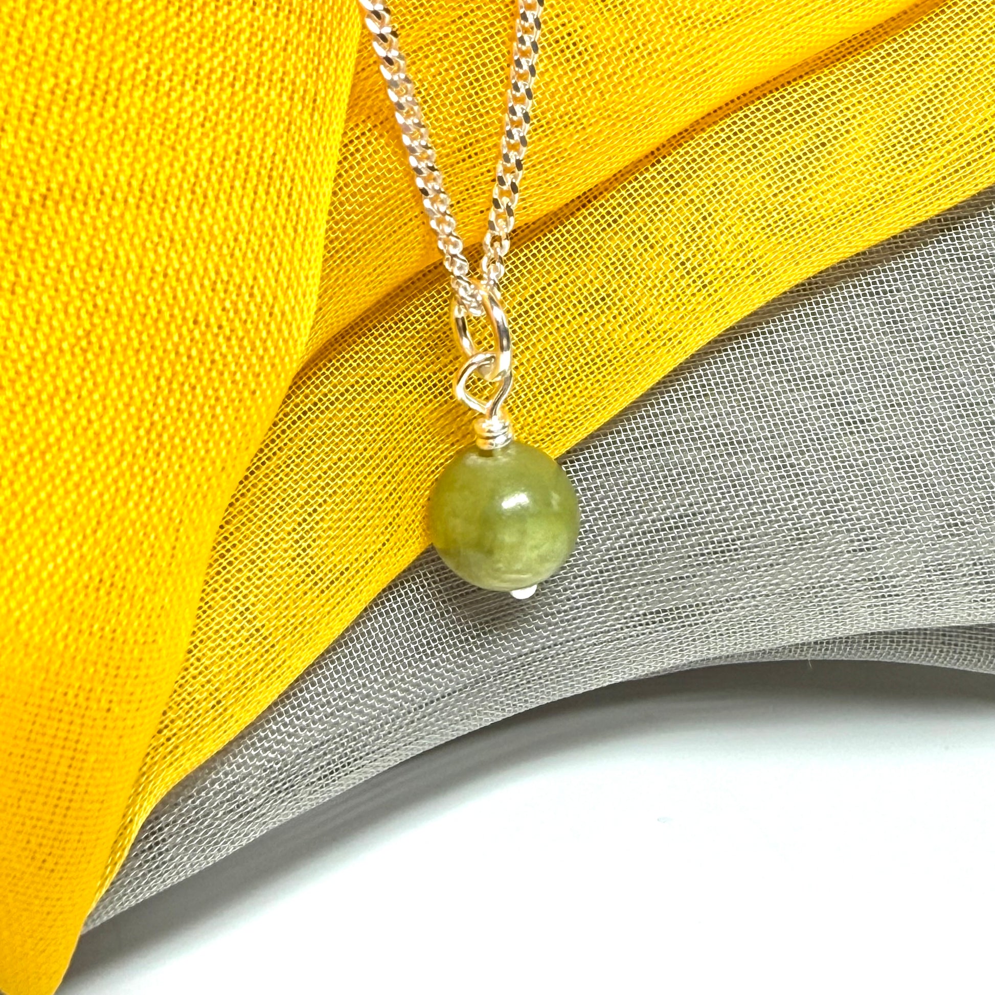 Small round 8.5 mm green real gypsum necklace ball shaped pendant with a chain