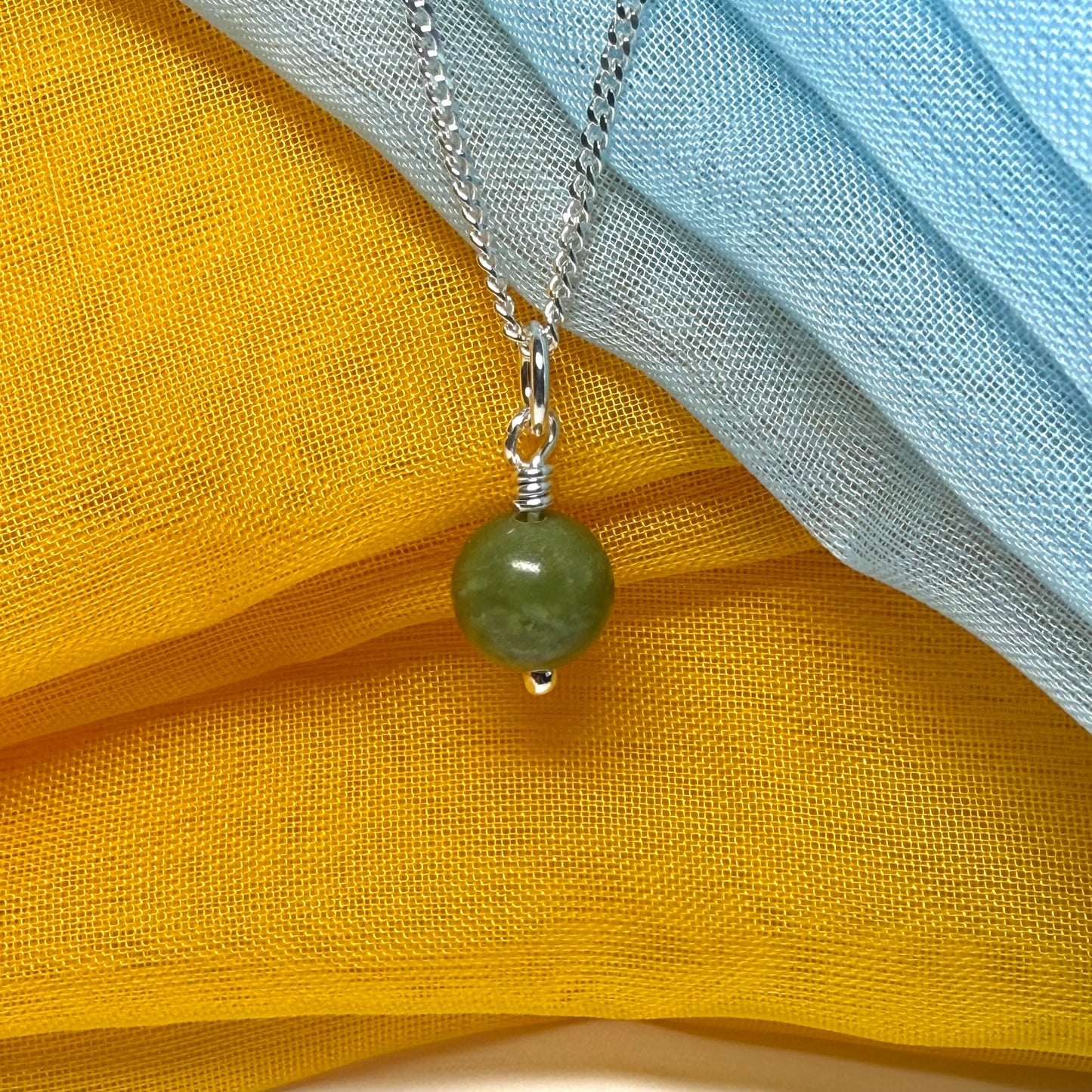 Small round real green gypsum necklace ball shape pendant with chain measuring 8.5 mm in diameter