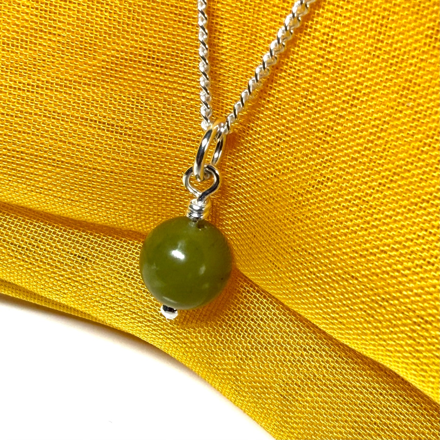 Small round real green gypsum necklace ball shape pendant with chain measuring 8.5 mm diameter