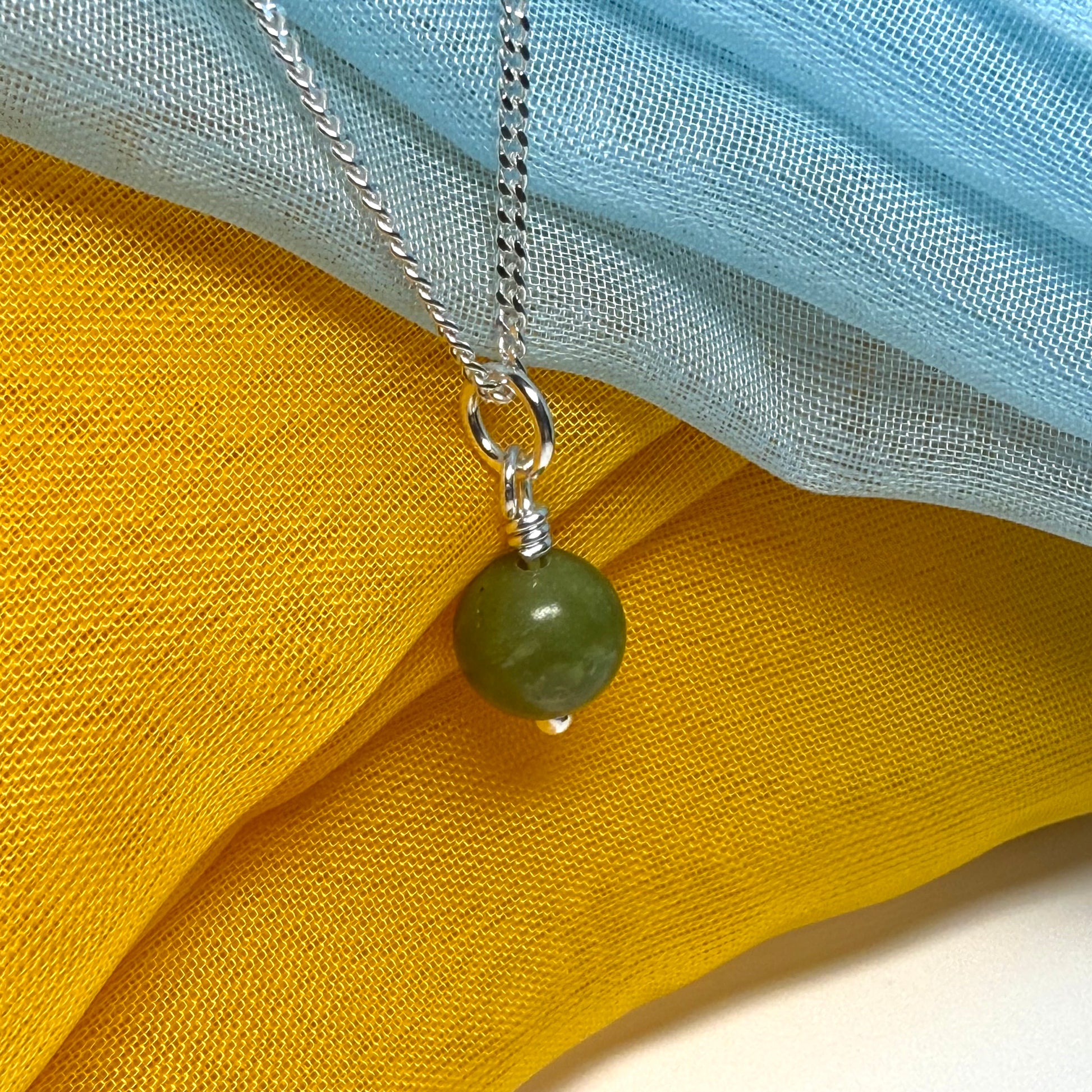 Small round real green gypsum necklace ball shape pendant with chain measuring 8.5 mm in diameter