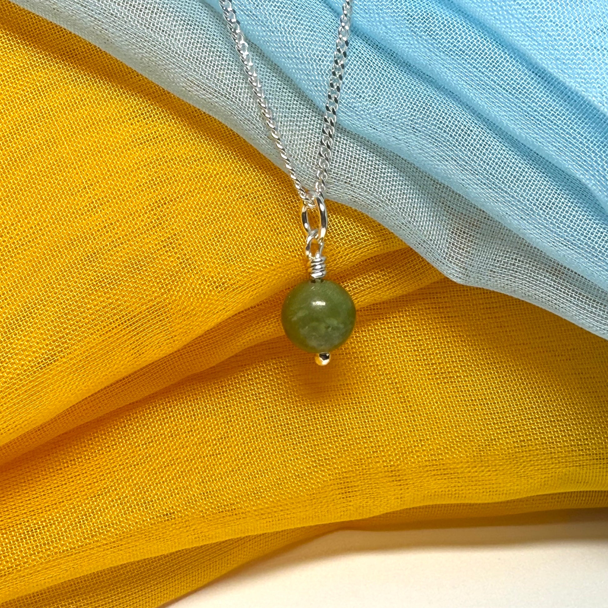 Small round real green gypsum necklace ball shape pendant with chain measuring 8.5 mm in diameter