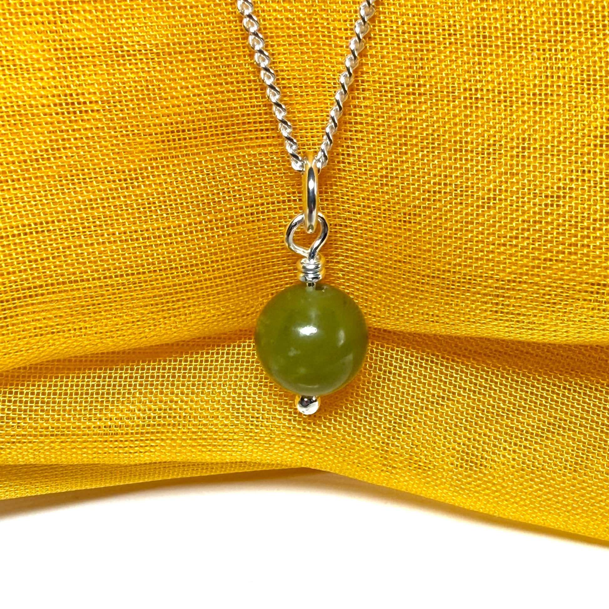 Small round real green gypsum necklace ball shape pendant with chain measuring 8.5 mm diameter