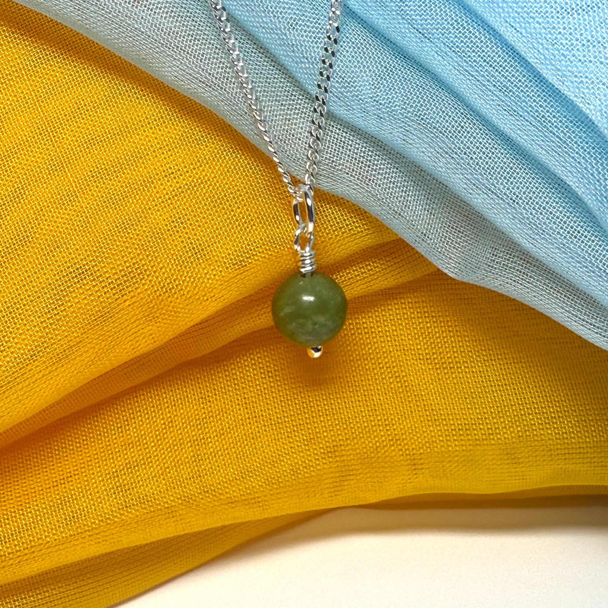 Small round real green gypsum necklace ball shape pendant with chain measuring 8.5 mm in diameter
