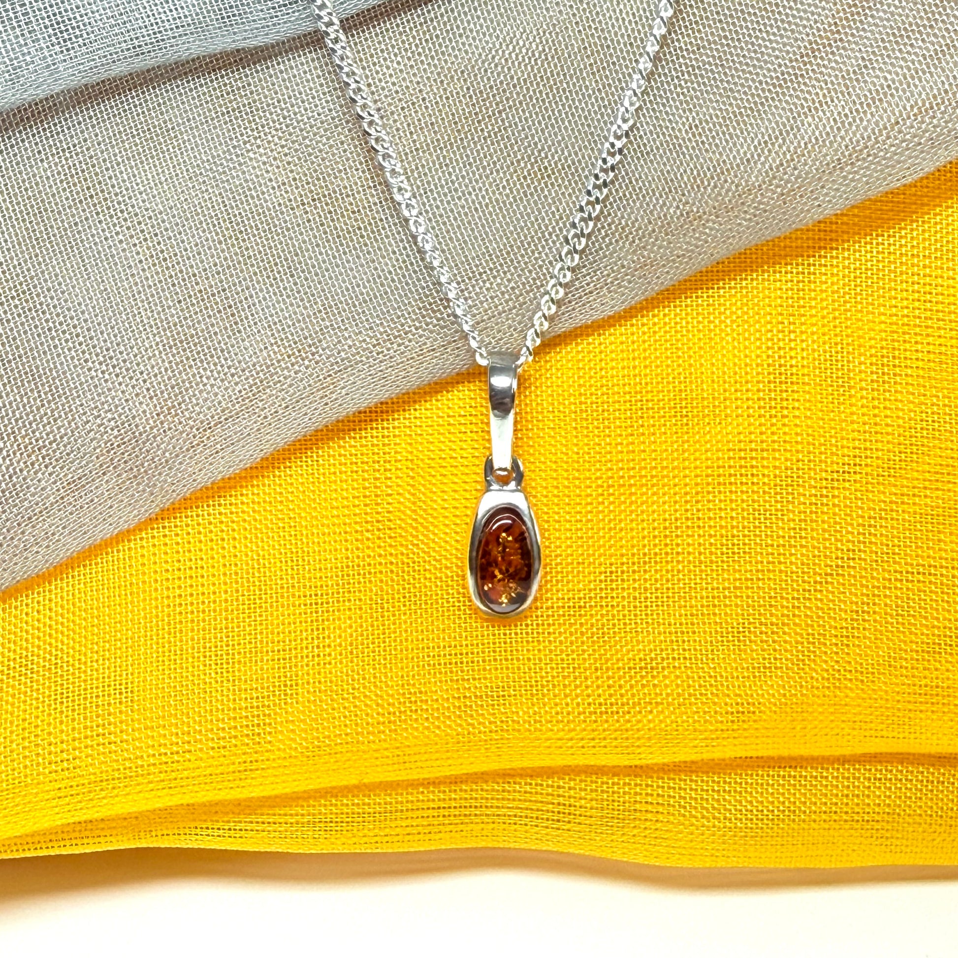 Small squared oval shaped real amber necklace pendant