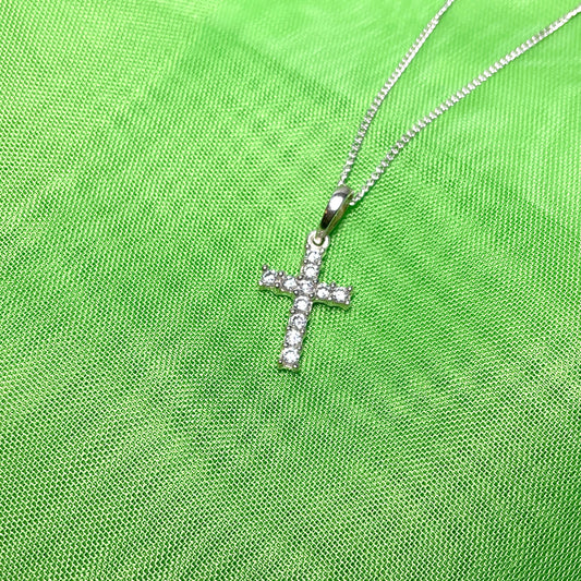 Small cubic zirconia set cross on a chain sterling silver