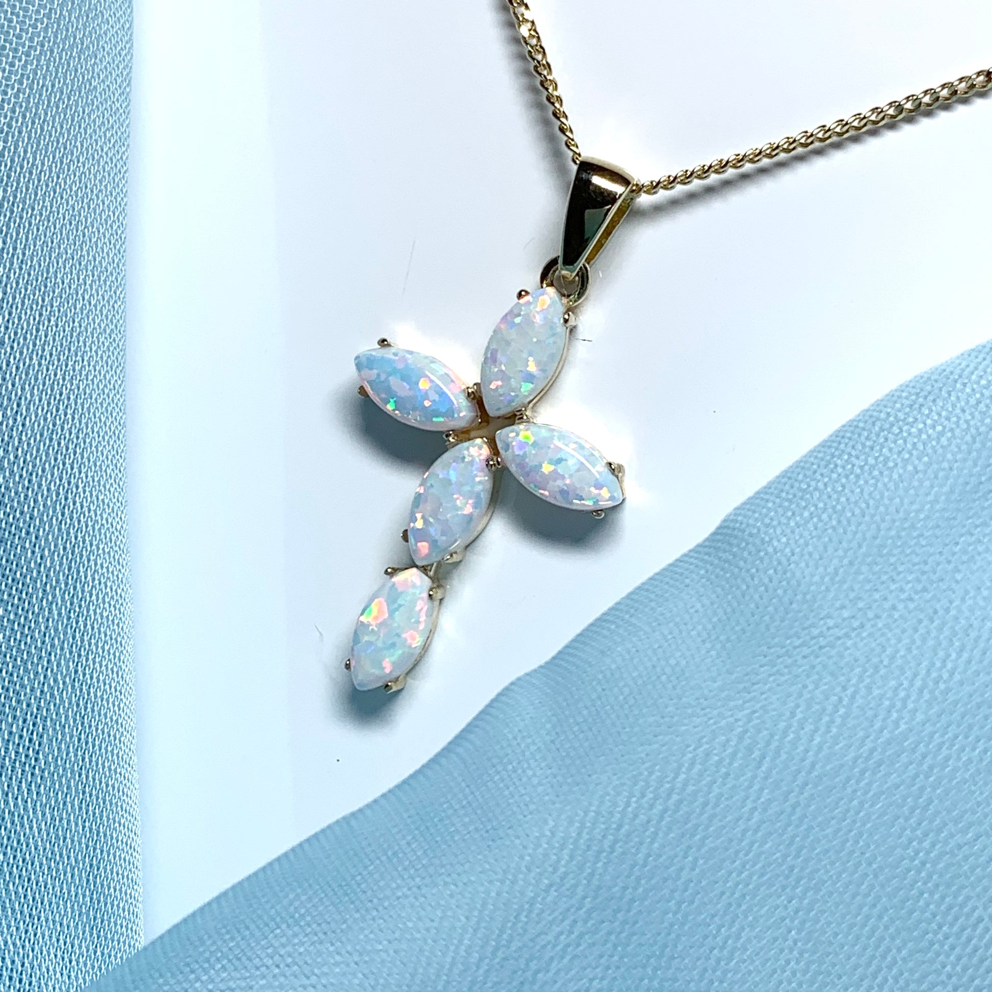 Small yellow gold opal cross necklace including chain