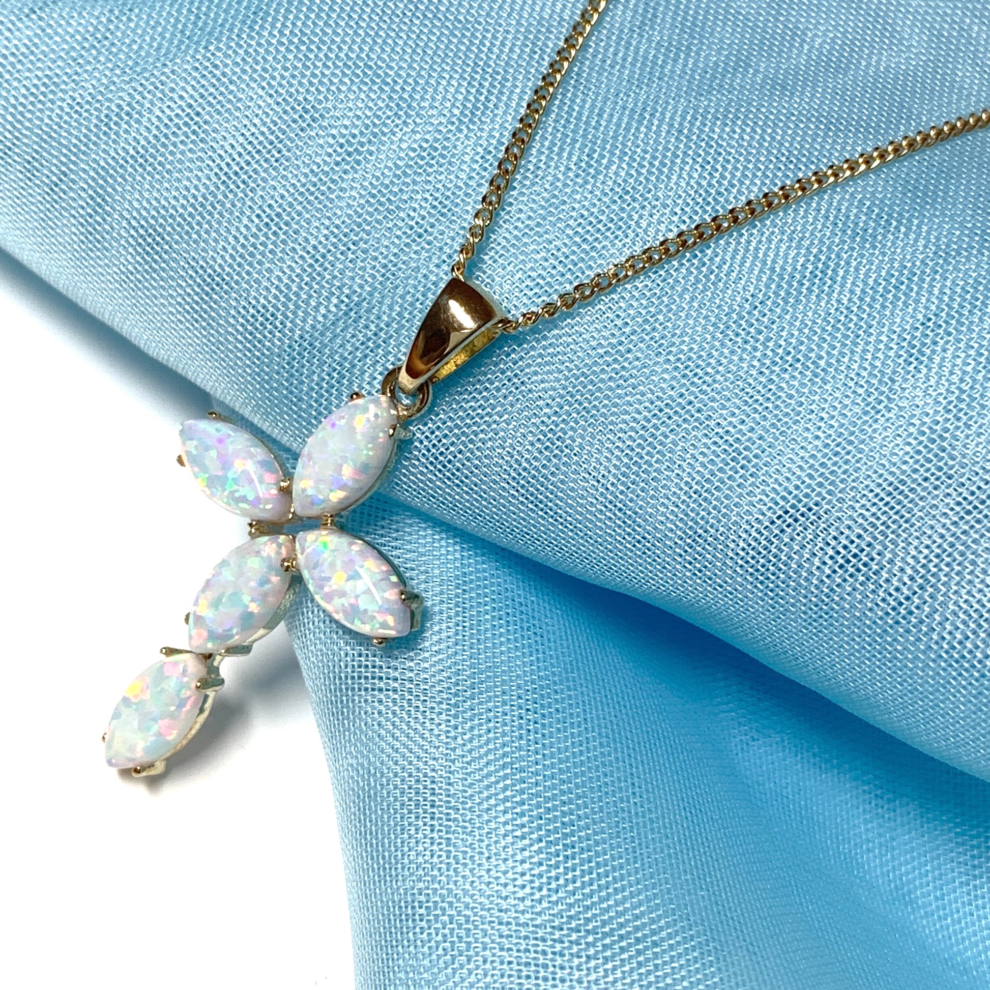 Small yellow gold opal cross necklace including chain