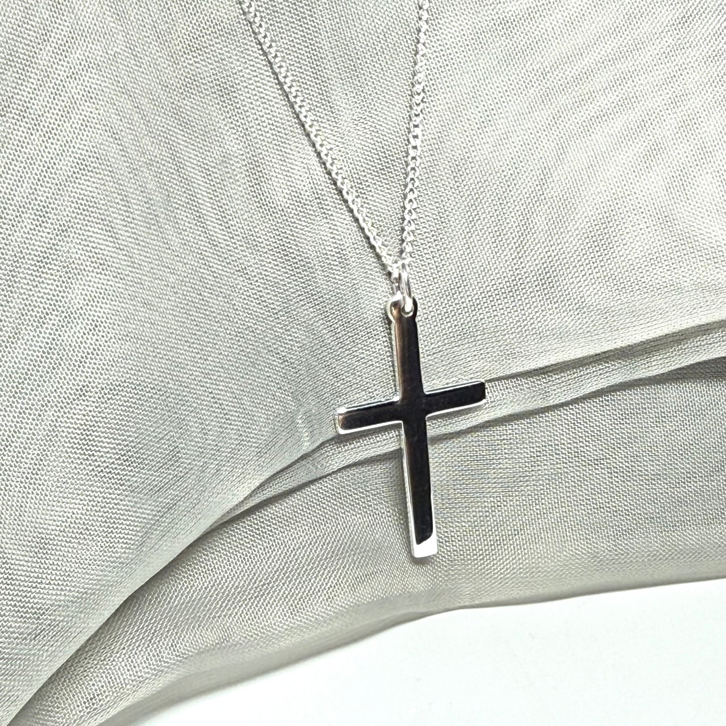 Cross and chain highly polished with a round pendant loop on top