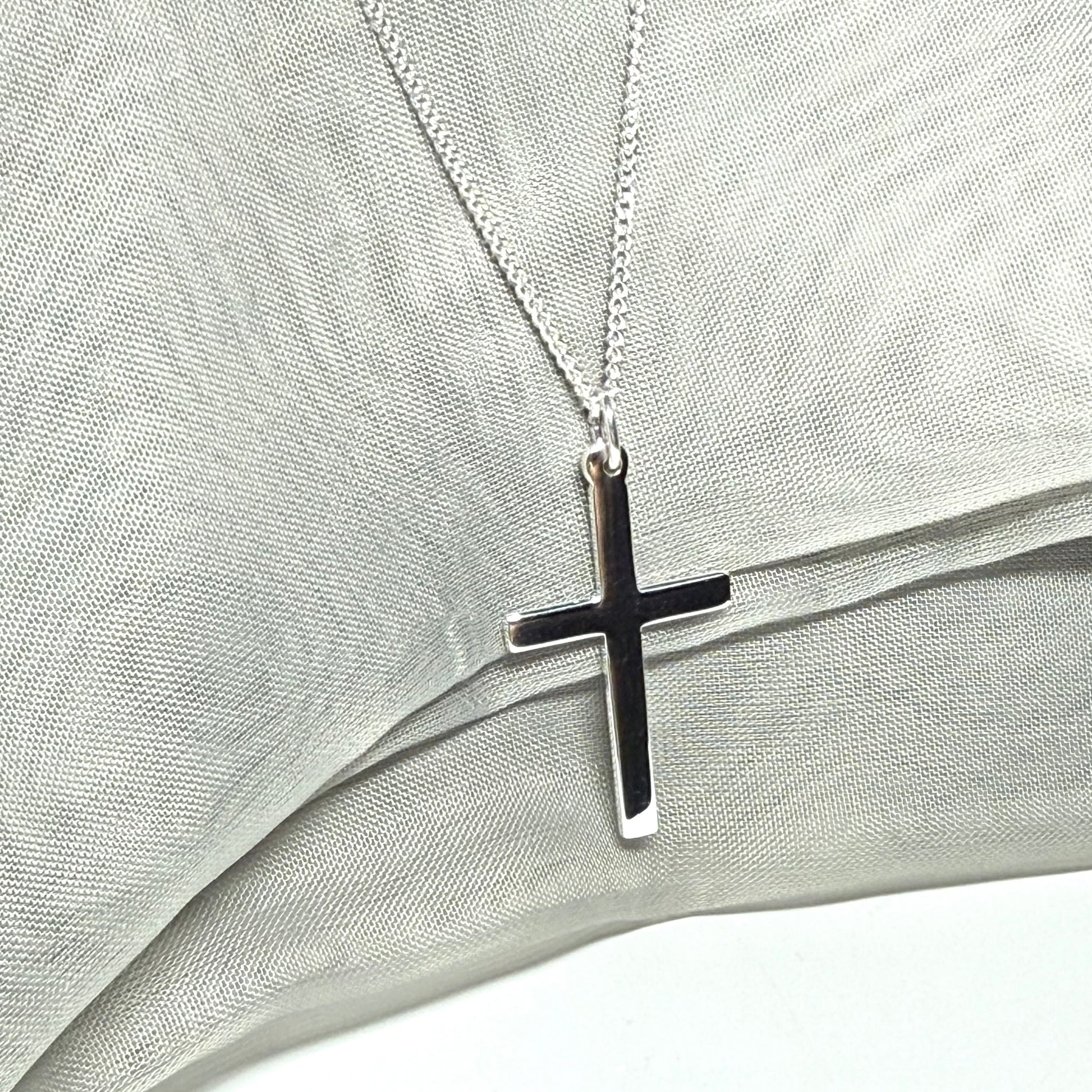Cross and chain highly polished with a round pendant loop on top